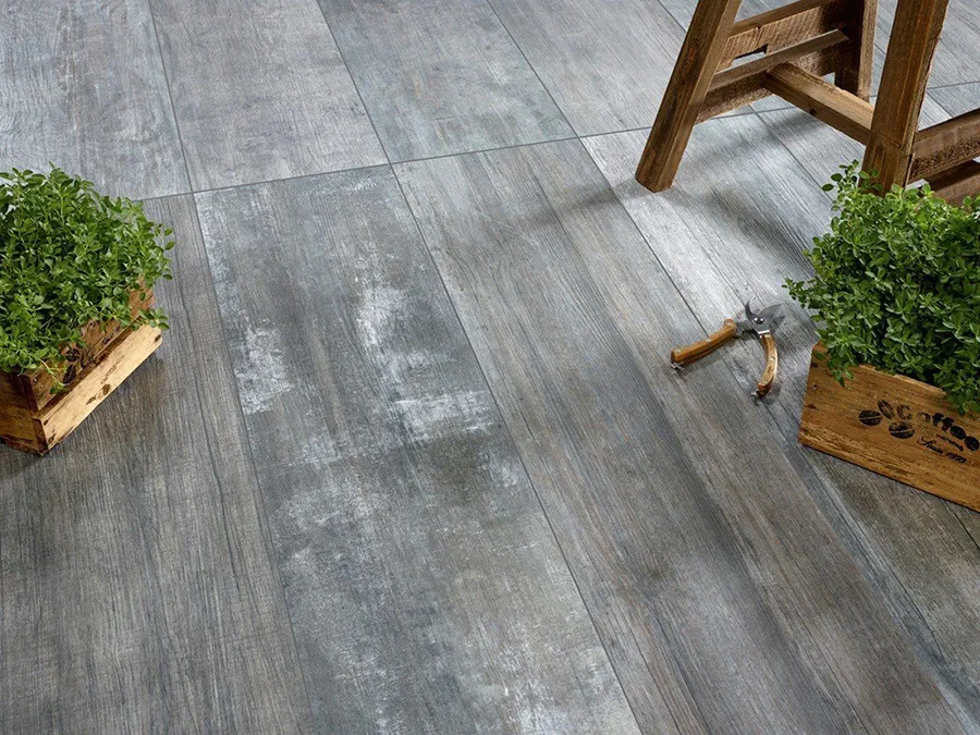 Grey Slabs are suggesting that the colour and texture range on offer is why tiles are better than decking. Grey Wood effect floor tiles are complimented by wooden accessories.
