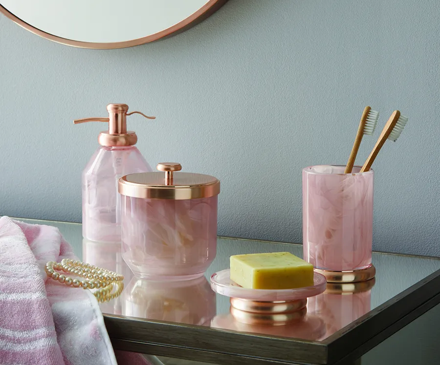 Pink and gold bathroom accessories
