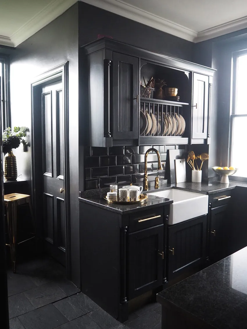 Black kitchen with gold hardware