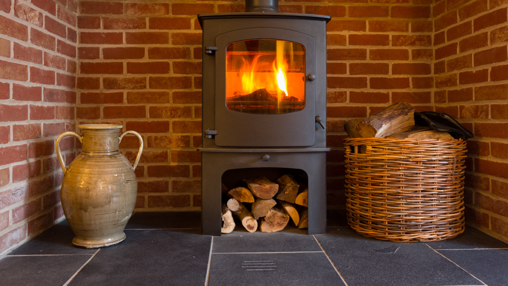 Tiles to use with stoves and wood burners include brick tiles used around matt black modern wood burner.
