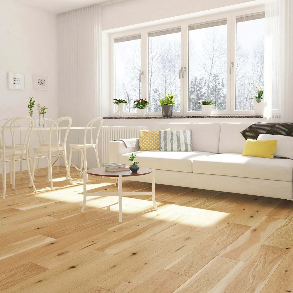 Wood effect flooring across dining room/ living space with light furniture and large window letting lots of light into the space. 